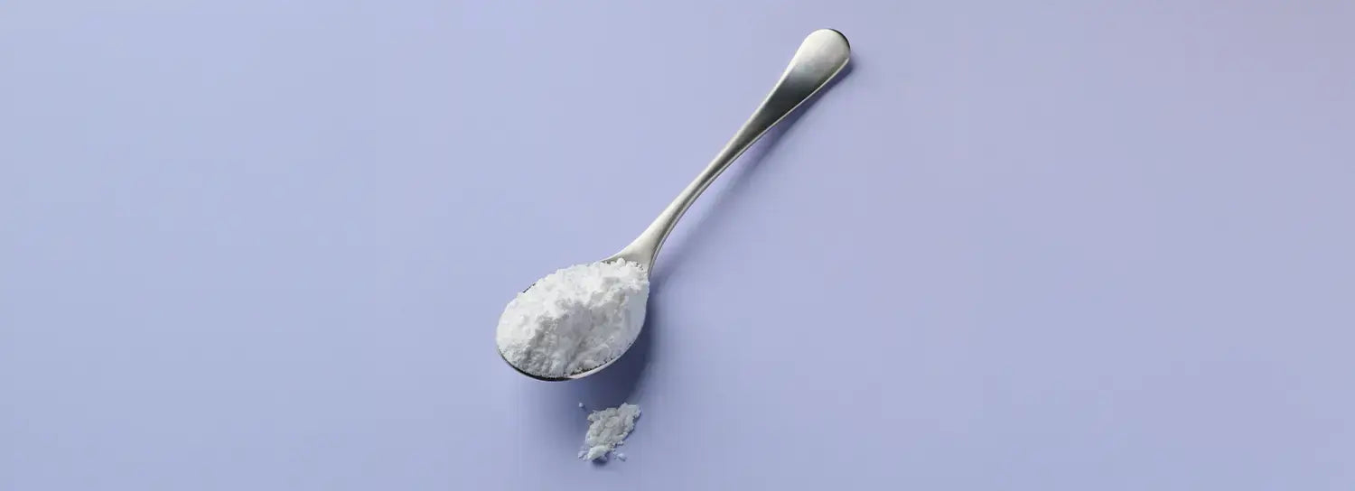 A spoonful of pure instantized creatine monohydrate powder