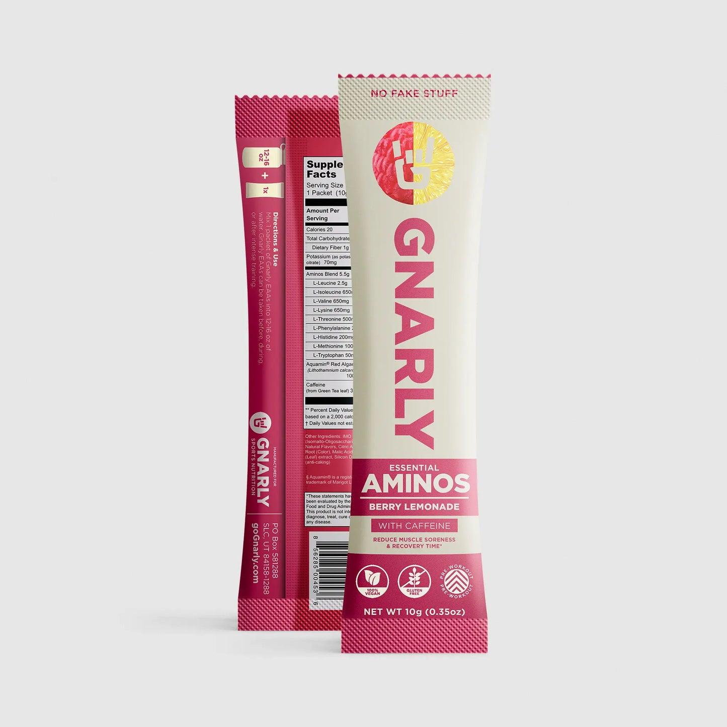 Two Gnarly Essential Aminos packets, one red and one white, on a light gray background.