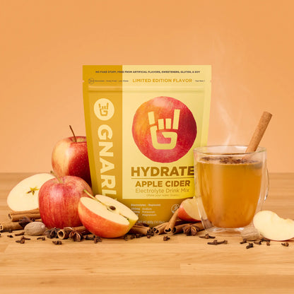 Gnarly Hydrate Apple Cider electrolyte packaging with apples, cinnamon and a cup of warm apple cider electrolytes