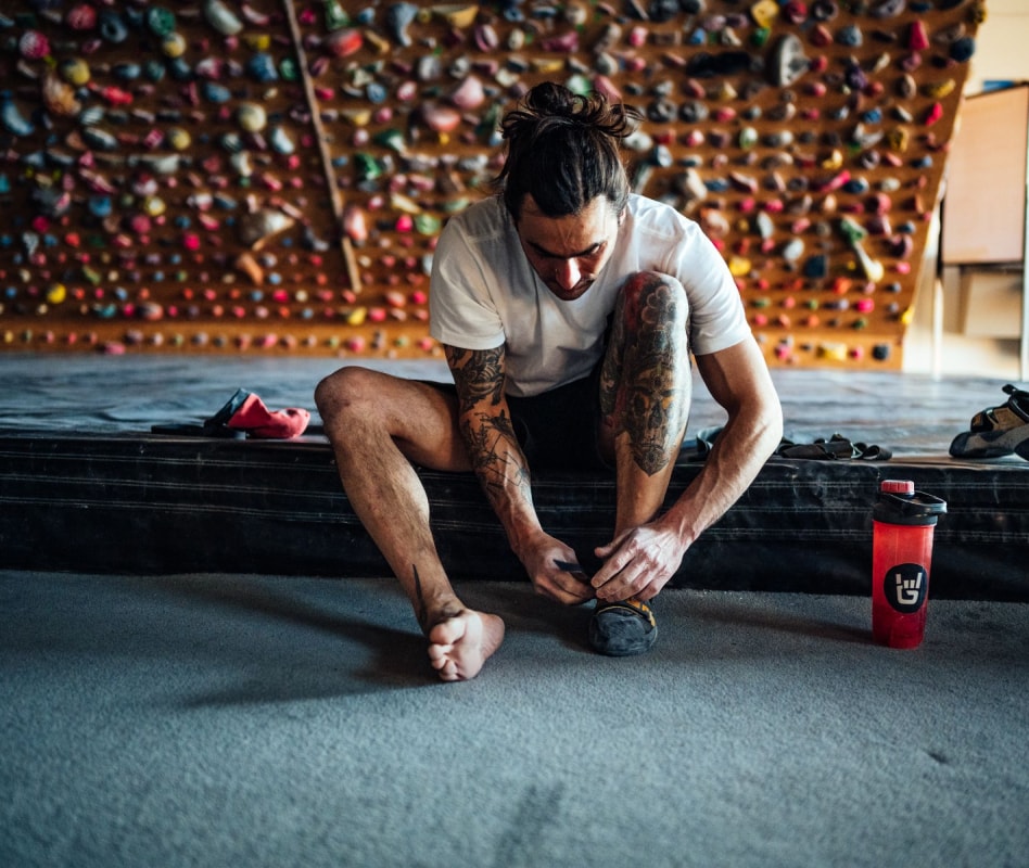 Athlete on mats preparing to workout.